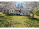 Inviting split-level home framed by blooming trees, set on a lush green lawn at 1692 Cumberland Trce, Acworth, GA 30102