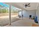 The covered patio features an outdoor ceiling fan for a comfortable outdoor dining or lounging experience at 2317 Pleasant Grove Rd, Temple, GA 30179