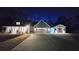 A charming home features a well-lit exterior with a long driveway at 2317 Pleasant Grove Rd, Temple, GA 30179