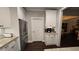 Well-equipped kitchen with stainless steel appliances, granite countertops, white cabinets, and a functional layout at 2317 Pleasant Grove Rd, Temple, GA 30179