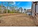 The large backyard is fully fenced and backs to trees, providing privacy and ample room for outdoor activities at 2317 Pleasant Grove Rd, Temple, GA 30179