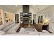 Bright living room boasts a brick fireplace, built-in shelving, a large sectional, and access to other rooms at 2317 Pleasant Grove Rd, Temple, GA 30179