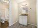 Bathroom featuring a shower-tub combo, vanity with a granite countertop, and modern fixtures at 2339 Chevy Chase Ln, Decatur, GA 30032
