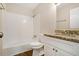 Bathroom features a tub/shower combination, granite vanity and wood look flooring at 2339 Chevy Chase Ln, Decatur, GA 30032