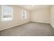 Bedroom with neutral carpet, two windows, and baseboard trim at 2339 Chevy Chase Ln, Decatur, GA 30032