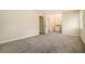 Spacious bedroom leading to ensuite bath with walk in closet and plush carpet at 2339 Chevy Chase Ln, Decatur, GA 30032