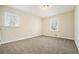Bright bedroom with neutral tones, two windows and plush carpet flooring at 2339 Chevy Chase Ln, Decatur, GA 30032