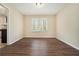 Bright dining room with wood laminate flooring and a window offering plenty of natural light at 2339 Chevy Chase Ln, Decatur, GA 30032
