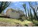 Exterior view features multi-tiered deck, brick and siding and mature trees at 2339 Chevy Chase Ln, Decatur, GA 30032