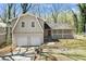 Charming home featuring a two-car garage, brick accents, and a welcoming front porch at 2339 Chevy Chase Ln, Decatur, GA 30032