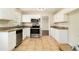 Kitchen with white cabinets, granite countertops, stainless steel appliances, and tile flooring at 2339 Chevy Chase Ln, Decatur, GA 30032