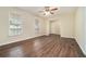 Bright living room with windows, ceiling fan, and gorgeous wood laminate flooring at 2339 Chevy Chase Ln, Decatur, GA 30032
