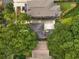 Aerial view of home showcasing the property, roof, and surrounding mature trees at 746 Amsterdam Ave, Atlanta, GA 30306