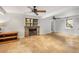 Spacious finished basement with decorative stone fireplace and updated ceiling fan and lighting at 746 Amsterdam Ave, Atlanta, GA 30306