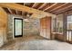 Inviting covered patio with stone flooring and accent wall, perfect for outdoor entertaining at 746 Amsterdam Ave, Atlanta, GA 30306