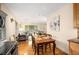 Open-concept dining room flows into the kitchen and living area with hardwood floors and natural light at 746 Amsterdam Ave, Atlanta, GA 30306