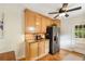 Updated kitchen boasts stainless appliances, granite countertops, tile backsplash, and light wood cabinetry at 746 Amsterdam Ave, Atlanta, GA 30306