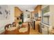 Eat-in kitchen features wooden cabinets, granite counters, stainless steel appliances, and a breakfast nook at 746 Amsterdam Ave, Atlanta, GA 30306
