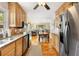 Well-lit kitchen showcasing wood cabinets, granite countertops, stainless steel appliances, and an open layout at 746 Amsterdam Ave, Atlanta, GA 30306