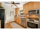 Updated kitchen includes stainless appliances, granite countertops, wooden cabinets, and a tile backsplash at 746 Amsterdam Ave, Atlanta, GA 30306