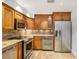 A beautifully finished kitchen features stainless steel appliances, custom cabinets, granite countertops, and undercabinet lighting at 746 Amsterdam Ave, Atlanta, GA 30306