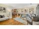 Bright living room featuring hardwood floors, neutral furniture, and an open floor plan at 746 Amsterdam Ave, Atlanta, GA 30306