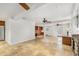 Spacious living area featuring travertine floors, white walls, modern lighting, and access to built-ins at 746 Amsterdam Ave, Atlanta, GA 30306