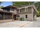 Back of home featuring a screened porch, gray paint, and driveway access at 746 Amsterdam Ave, Atlanta, GA 30306