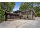Rear exterior of home featuring a screened porch, gray paint, and driveway access at 746 Amsterdam Ave, Atlanta, GA 30306