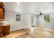 Well-lit room features travertine floors, neutral paint, built-in shelving, and a door to the backyard at 746 Amsterdam Ave, Atlanta, GA 30306