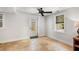 Bright, airy room with travertine floors, fresh paint, a ceiling fan, and a rear door at 746 Amsterdam Ave, Atlanta, GA 30306