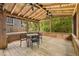 Spacious screened porch with ceiling fans and dining area, offering a relaxing outdoor space at 746 Amsterdam Ave, Atlanta, GA 30306