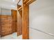 Spacious walk-in closet with custom wood cabinetry and shelving for optimal storage and organization at 746 Amsterdam Ave, Atlanta, GA 30306