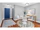 Cozy dining room with hardwood floors and stylish decor, accentuated by natural light at 8303 Santa Fe Pkwy, Atlanta, GA 30350