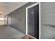 Exterior apartment entrance with gray siding, a dark-colored door, and visible unit number 8303 at 8303 Santa Fe Pkwy, Atlanta, GA 30350