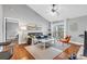 Bright living room with hardwood floors, vaulted ceilings, and access to a private balcony at 8303 Santa Fe Pkwy, Atlanta, GA 30350