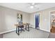 Office space with modern desk, chair and a blue painted door leading to a bathroom at 8303 Santa Fe Pkwy, Atlanta, GA 30350