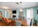 Open dining area featuring a wood table, modern lighting, and seamless flow to the living spaces for easy entertaining at 1297 Partridge Ln, Riverdale, GA 30296