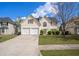 Charming two-story home with a two-car garage, a well-manicured lawn, and a classic suburban appeal at 1297 Partridge Ln, Riverdale, GA 30296