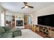 Spacious living room with a fireplace, modern decor, and an open layout, perfect for entertaining guests at 1297 Partridge Ln, Riverdale, GA 30296