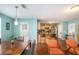 Inviting living room with dining area and kitchen featuring hardwood floors and modern lighting at 1297 Partridge Ln, Riverdale, GA 30296