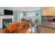 Open-concept living space with a fireplace, a dining area, and sleek hardwood flooring, ideal for modern living at 1297 Partridge Ln, Riverdale, GA 30296