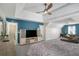 Large main bedroom with sitting area, large TV, and decorative ceiling at 1297 Partridge Ln, Riverdale, GA 30296