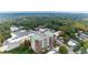 Aerial view of building with lush green trees and surrounding commercial neighborhood at 3820 Roswell Ne Rd # 902, Atlanta, GA 30342