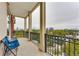 Relaxing balcony with wrought iron railing offering city views and blue chairs at 3820 Roswell Ne Rd # 902, Atlanta, GA 30342