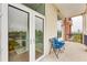 Balcony with black wrought iron railing overlooking city buildings and tree lined street at 3820 Roswell Ne Rd # 902, Atlanta, GA 30342