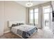 Bedroom featuring a ceiling fan, access to a balcony and view of the city skyline at 3820 Roswell Ne Rd # 902, Atlanta, GA 30342