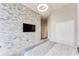 Bedroom featuring a stone accent wall, neutral walls, carpeted floor, and large double door closet at 3820 Roswell Ne Rd # 902, Atlanta, GA 30342
