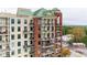 Exterior of modern building with multiple balconies and red brick design accents at 3820 Roswell Ne Rd # 902, Atlanta, GA 30342