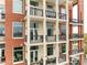 Exterior view of building with multiple balconies with black wrought iron railings at 3820 Roswell Ne Rd # 902, Atlanta, GA 30342